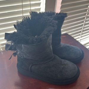 Girls black UGG boots size 11 with bows on back